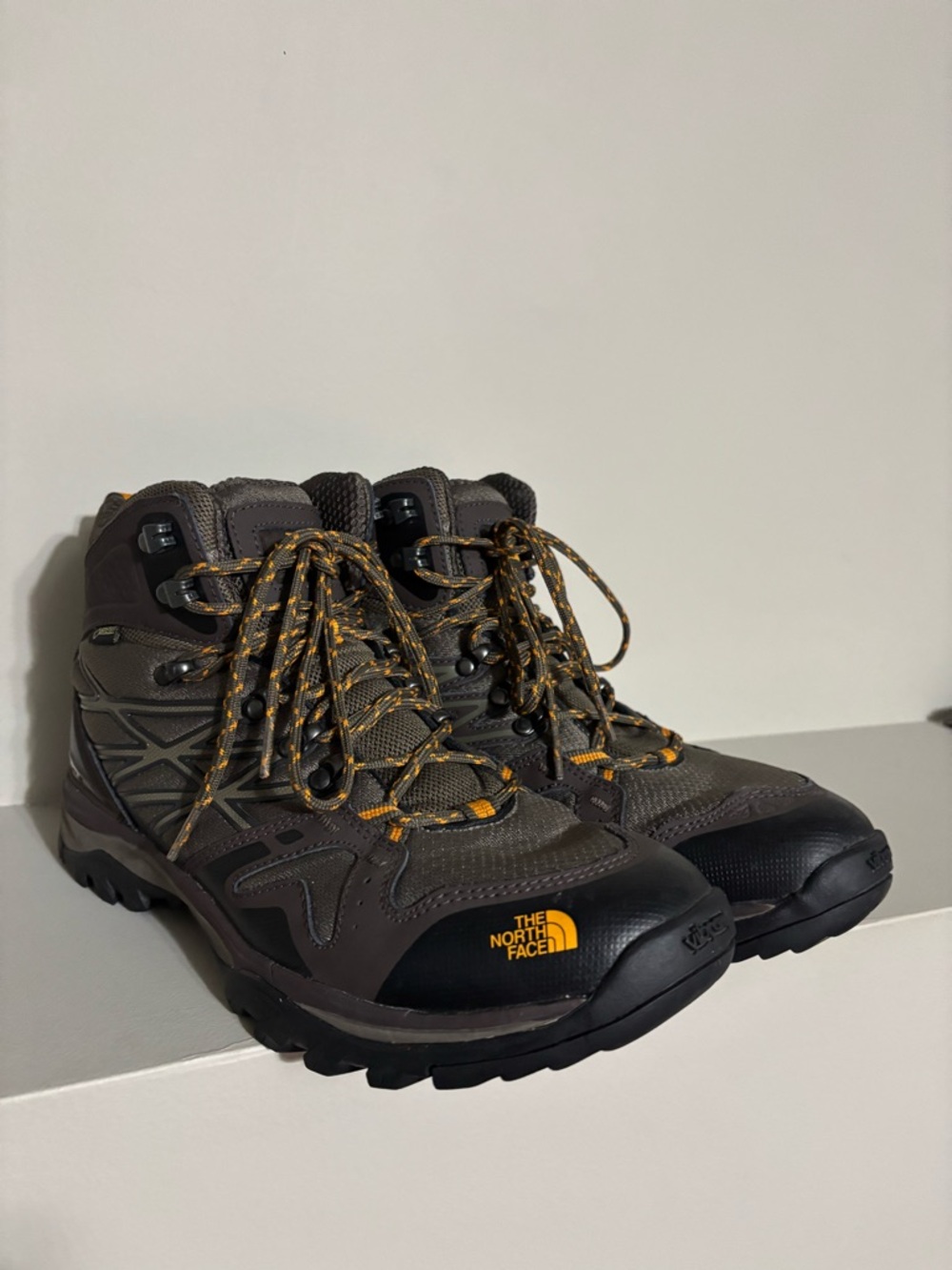 The North Face Men's Dark Brown and Black Hiking Boots with Yellow Accents